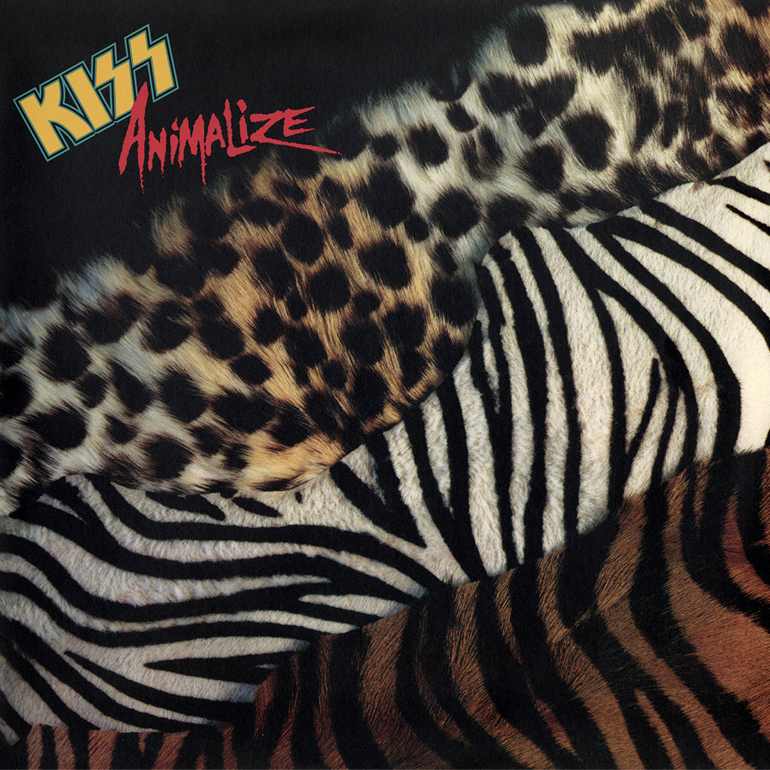 Album cover with 'Kiss Animalize' text with leopard, zebra and tiger print rugs.