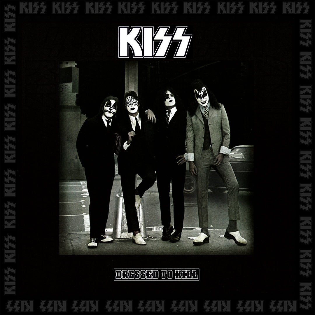 Four band members standing on the sidewalk dressed in suits and the title 'Dressed to Kill'.