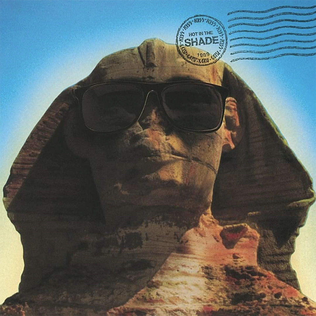 Egyptian Sphinx wearing sunglasses with a 'Hot in the Shade' stamp on a blue sky background