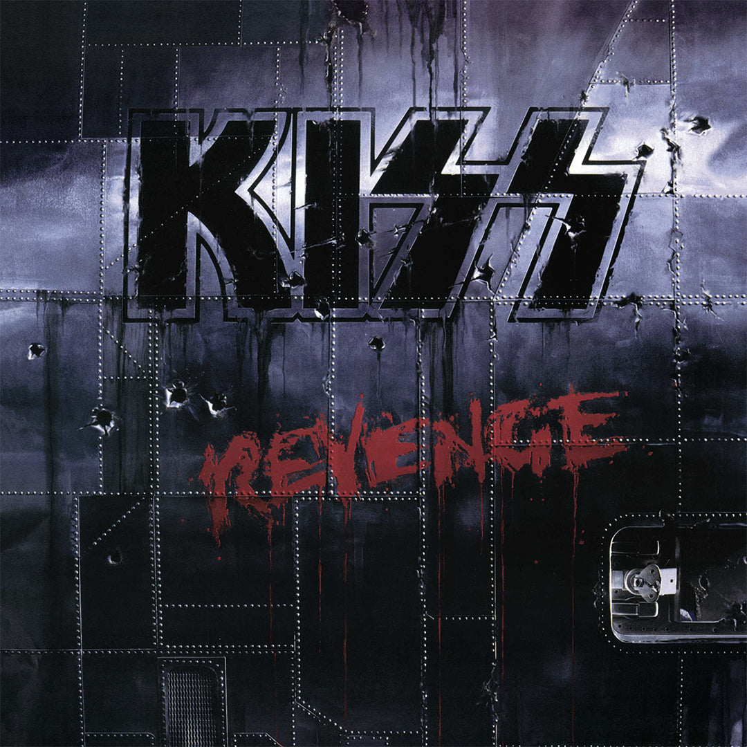 'KISS Revenge' painted on the side of a vintage metal warplane.